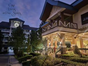 a large building with a clock tower on top of it at Casa Lucas in Tagaytay