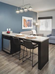 a kitchen with a large island in a living room at stayAPT Suites Cleveland TN in Cleveland