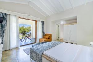 A bed or beds in a room at Alya Villa Butik Hotel Még 37 kép
