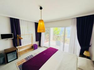 A bed or beds in a room at Fuda Hotel