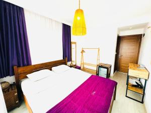 A bed or beds in a room at Fuda Hotel