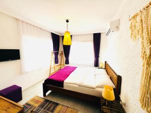 A bed or beds in a room at Fuda Hotel