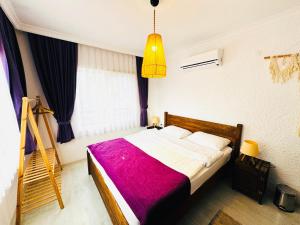 A bed or beds in a room at Fuda Hotel