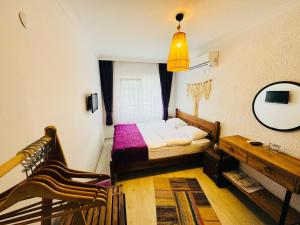 A bed or beds in a room at Fuda Hotel