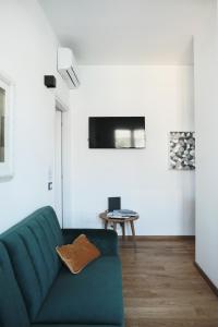 TV a/nebo společenská místnost v ubytování ComeCasa Città Studi Terraced Apartment