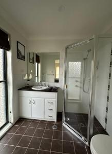 a bathroom with a shower and a sink at Balgowlah as home in Sydney