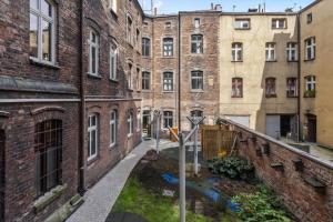 a view of an alley in an old building at Tiny and cosy studio only 4 you in Katowice