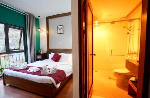 Letto o letti in una camera di NT Elysian hotel