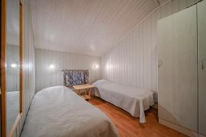 Postel nebo postele na pokoji v ubytování NordHaus 5 A3 by Aavalevi Holidays, Levi Center