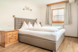 Łóżko lub łóżka w pokoju w obiekcie Appartement Arnoldgut