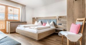 Łóżko lub łóżka w pokoju w obiekcie Appartement Arnoldgut