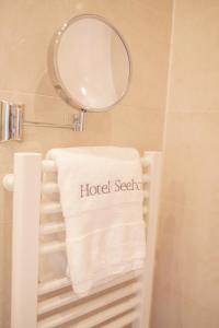 a towel on a towel rack in a bathroom at Hotel Seehof Norderney OHG in Norderney