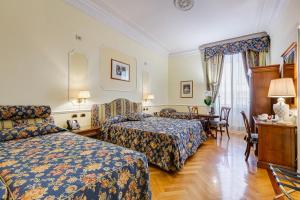Voodi või voodid majutusasutuse Hotel Cellini toas