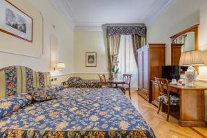 Voodi või voodid majutusasutuse Hotel Cellini toas