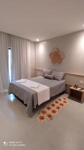 Ένα ή περισσότερα κρεβάτια σε δωμάτιο στο AMARÉ Condominio ap 101