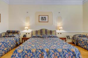 Voodi või voodid majutusasutuse Hotel Cellini toas