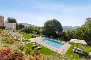 an image of a backyard with a swimming pool at Residence Conca Verde 1 with pool in Trarego Viggiona