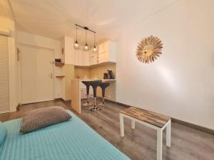 a living room with a table and a kitchen at TLN-0013 - Domaine de la Coudoulière - Proximité plages in Six-Fours-les-Plages