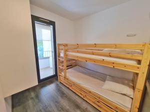 a bunk bed in a room with a window at TLN-0013 - Domaine de la Coudoulière - Proximité plages in Six-Fours-les-Plages