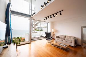 a living room with a couch and a table at InkaHuset Miraflores Oceanfront in Lima