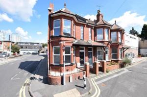 an old brick building on the corner of a street at Great located Victorian house with all amenities in Bristol