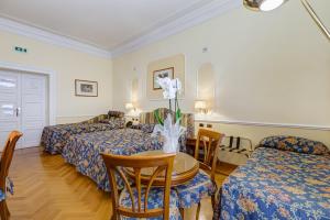 Voodi või voodid majutusasutuse Hotel Cellini toas