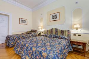 Voodi või voodid majutusasutuse Hotel Cellini toas