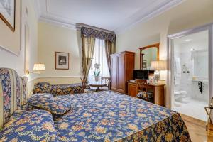 Voodi või voodid majutusasutuse Hotel Cellini toas