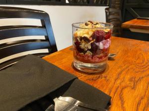 a glass jar of fruit and nuts on a wooden table at The Fishmongers Tavern in Sheringham
