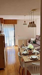 a living room with a table and a couch at Marival - Playa Langosteira - Fisterra - Finisterre in Fisterra +9 photos