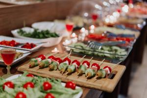 a buffet of food with vegetables on skewers on a table at Taşhan Hotel in Edirne