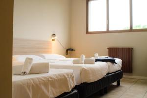 Posteľ alebo postele v izbe v ubytovaní Hp Fly Hotel Bologna