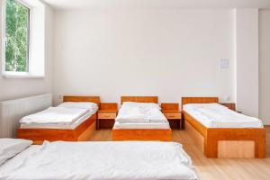 Postel nebo postele na pokoji v ubytování Hostel Beskydy