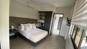 Postel nebo postele na pokoji v ubytování Hotel Le Falep & Spa