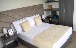 Postel nebo postele na pokoji v ubytování Hotel Le Falep & Spa