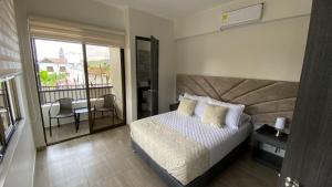 Postel nebo postele na pokoji v ubytování Hotel Le Falep & Spa