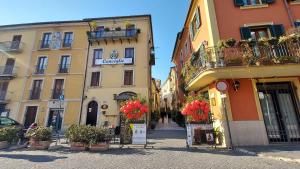 a group of buildings with flowers in front of them at Portella delle Fate in Sora