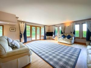 a living room with two couches and a rug at Loch Lomond Luxury Lodges in Drymen +175 photos