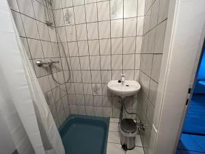 a small bathroom with a sink and a toilet at Apartment R41 in Essen
