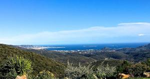 a view of the ocean from a mountain at Luxury Villa in a Private Domain, Amazing View on Cannes Bay, Close to Beach, Free Tennis Court, Bowl Game in Les Adrets de l'Esterel
