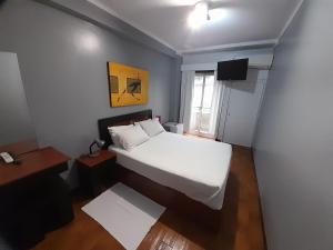Cama ou camas em um quarto em Hotel Dom Joao IV mais 15 fotos