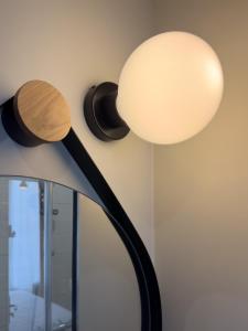 a black and white lamp with a white lamp shade at ibis Paris Boulogne Billancourt in Boulogne-Billancourt