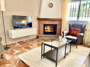 TV a/nebo společenská místnost v ubytování Casa rural Lomalinda