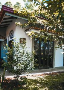 a front door of a house with windows at Villa Ali in Galle