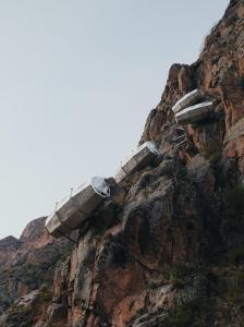 a bridge on the side of a mountain at Starlodge Adventure Suites in Urubamba