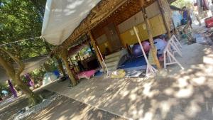 a building with a tent with a playground at Secluded Glamping Yoga Samadhi Resort 