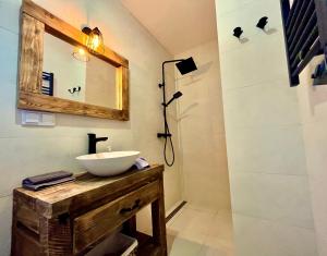 a bathroom with a sink and a mirror at Villa Corvo Bianco in Sidzina +42 photos