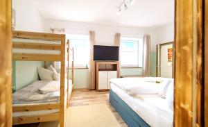 A bed or beds in a room at DMG - 'Funky First Floor' Unique Mountain Apartment