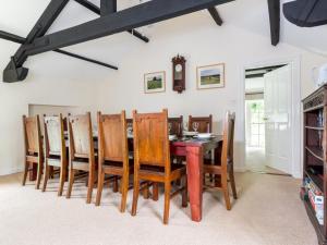 a dining room with a wooden table and chairs at 6 Bed in Lamplugh SZ151 in Lamplugh