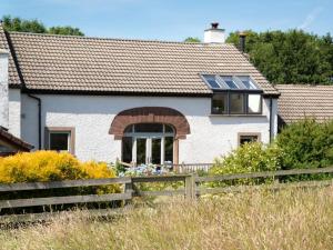 a house with solar panels on the roof at 3 Bed in Haile SZ230 in Hale